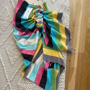 Just Be Queen multi color sarong. snap closure at waist and asymmetrical fit.